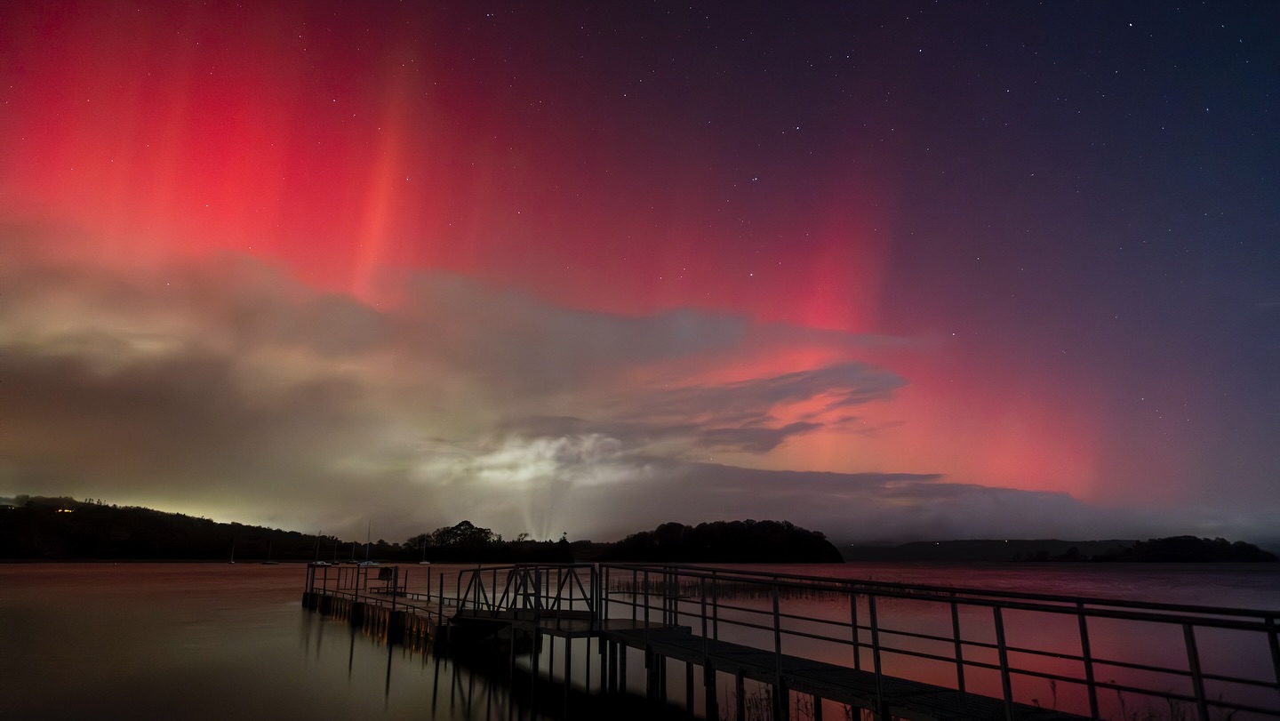 Panoramic view of the Sligo coastline at sunset, representing the local landscape.