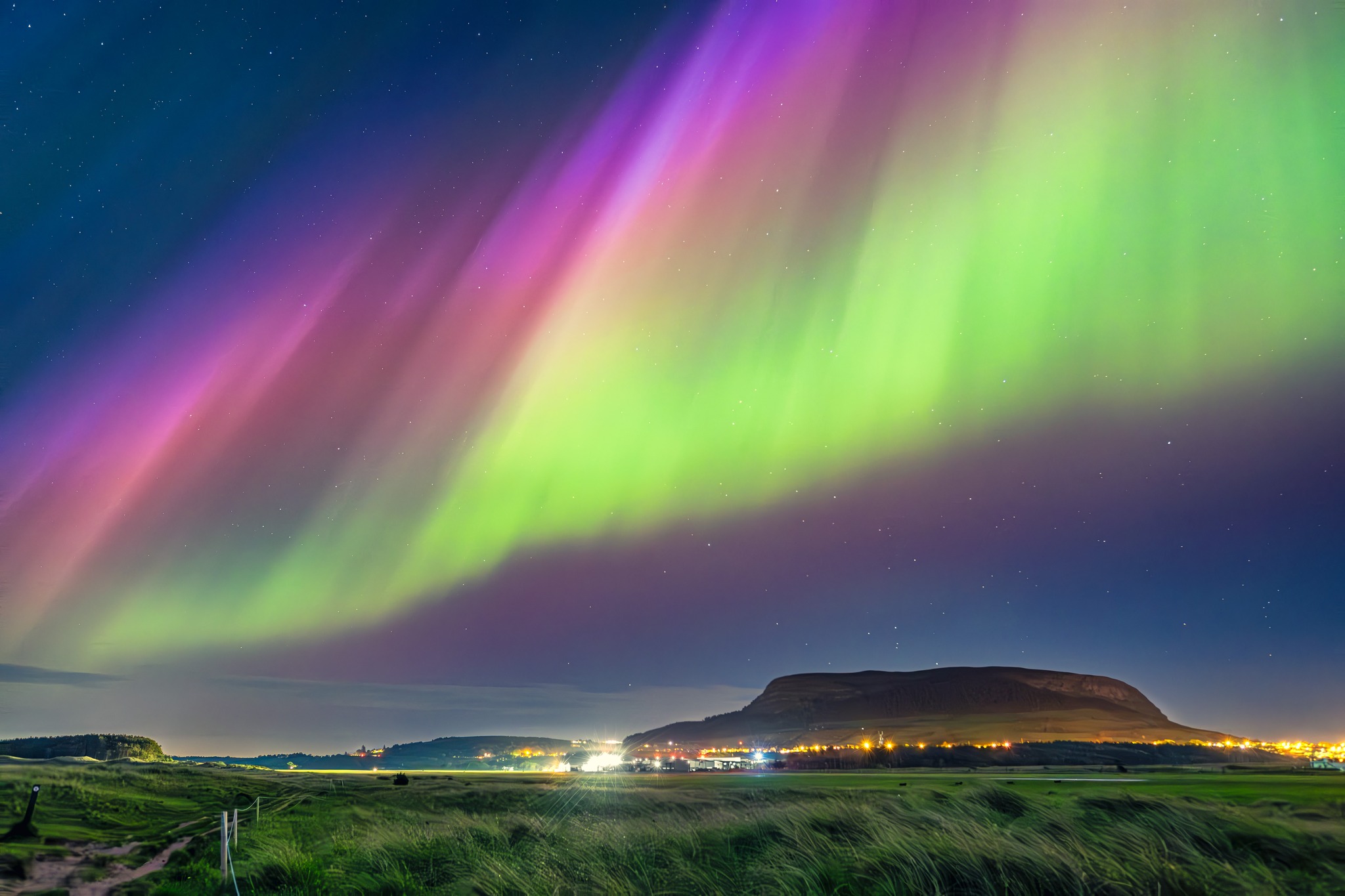 Panoramic view of the Sligo coastline at sunset, representing the local landscape.