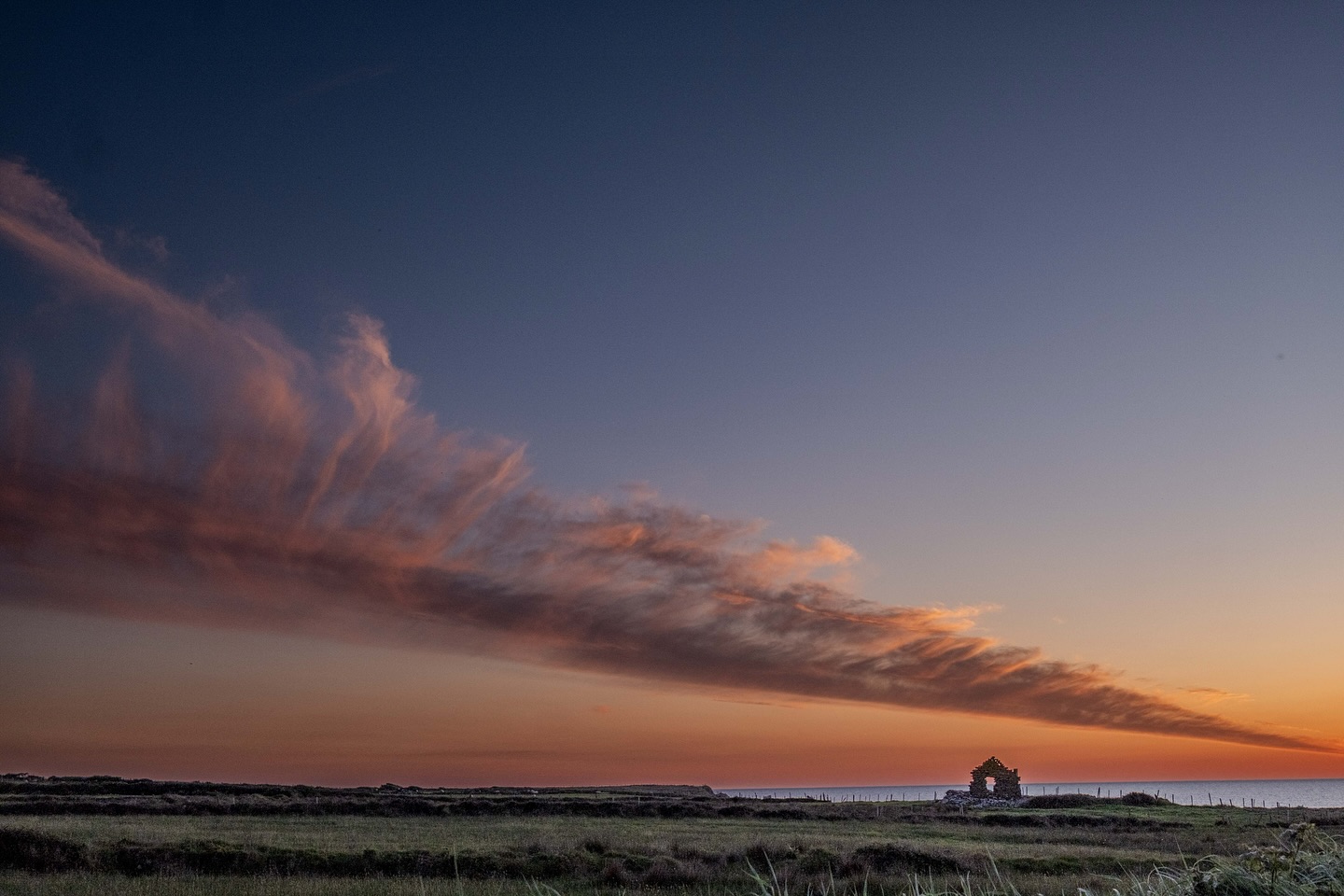 Panoramic view of the Sligo coastline at sunset, representing the local landscape.